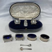 SILVER 3 PIECE CRUET SET WITH BLUE GLASS LINERS & 2 PAIRS OF SILVER SALTS WITH BLUE GLASS LINERS -