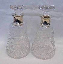 PAIR OF SILVER MOUNTED CUT GLASS DECANTERS,