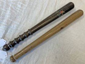 PLAIN HARDWOOD TRUNCHEON 39CM LONG & 1 OTHER TRUNCHEON WITH TRACES OF A COAT OF ARMS,