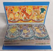 QUANTITY OF TOPPS POKEMON TV ANIMATION TRADING CARS IN BLUE FOLDER