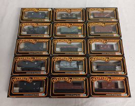 FIFTEEN EIGHT OO GAUGE WAGONS BY INCLUDING UNITED MOLASSES TANK WAGON, B.R. GREY HOPPER WAGON, B.P.