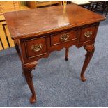 WALNUT LOWBOY WITH 3 DRAWERS ON SHAPED SUPPORTS.