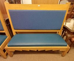 OAK BENCH WITH PADDED BACK & SEAT ON SQUARE SUPPORTS.