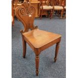 19TH CENTURY OAK HALL CHAIR WITH DECORATIVE CARVED BACK ON TURNED SUPPORTS