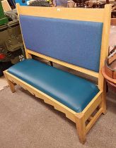OAK BENCH WITH PADDED BACK & SEAT ON SQUARE SUPPORTS.