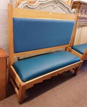 OAK BENCH WITH PADDED BACK & SEAT ON SQUARE SUPPORTS.