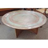 LARGE COPPER MIDDLE EASTERN STYLE CIRCULAR TRAY WITH ETCHED DECORATION ON STAND.