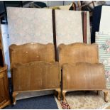 PAIR OF EARLY 20TH CENTURY VONO SINGLE BED FRAMES WITH OAK AND WALNUT HEAD AND FOOTBOARDS