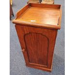 19TH CENTURY MAHOGANY CABINET WITH GALLERY TOP OVER SINGLE PANEL DOOR ON PLINTH BASE,