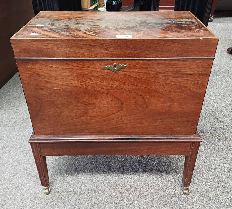 LATE 19TH CENTURY INLAID MAHOGANY CELLARETTE ON REEDED SQUARE TAPERED SUPPORTS.