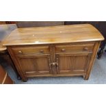 ERCOL ELM SIDEBOARD WITH 2 DRAWERS OVER 2 PANEL DOORS.