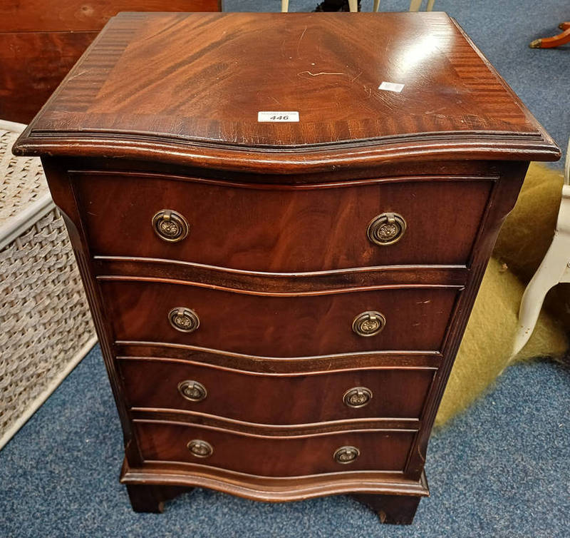 20TH CENTURY SMALL MAHOGANY 4 DRAWER CHEST WITH SERPENTINE FRONT ON BRACKET SUPPORTS.