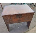 19TH CENTURY OAK STORAGE BOX WITH LIFT LID TOP & CARVED DECORATION TO FRONT INTIALLED 'SW'.