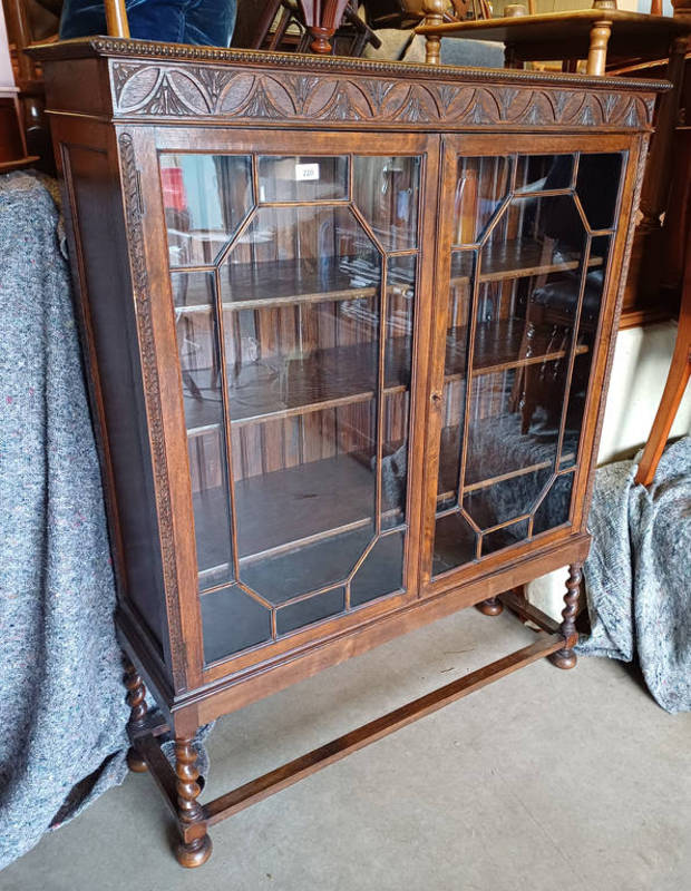 ARTS & CRAFTS STYLE OAK BOOKCASE WITH 2 ASTRAGAL GLASS PANEL DOORS OPENING TO SHELVED INTERIOR ON