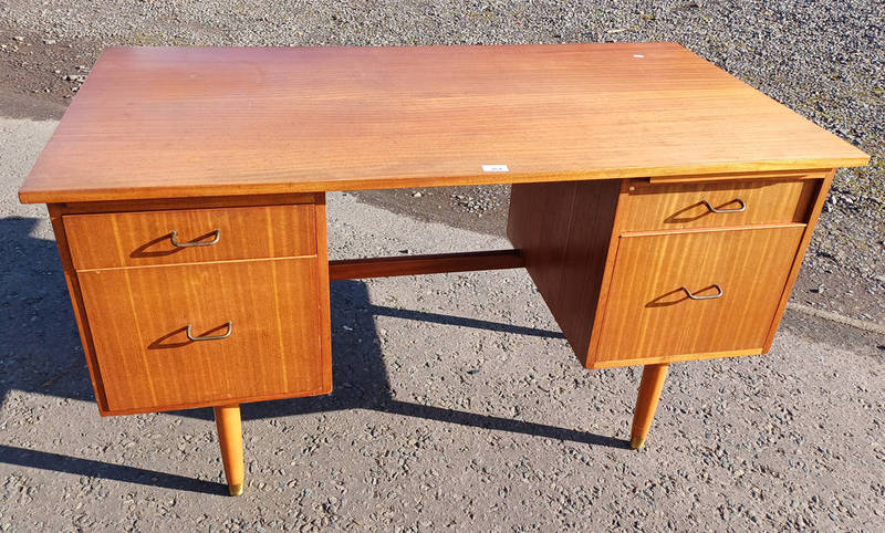 TEAK KNEE-HOLE DESK WITH 4 DRAWERS ON TAPERED SUPPORTS. SIGNED MORRIS OF GLASGOW TO DRAWER.