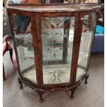 DISPLAY CABINET WITH SINGLE GLAZED PANEL DOOR OPENING TO GLASS SHELVED INTERIOR ON SHORT QUEEN ANNE