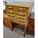 EARLY 20TH CENTURY OAK FILING CHEST OF 8 DRAWERS ON STAND WITH TURNED SUPPORTS.