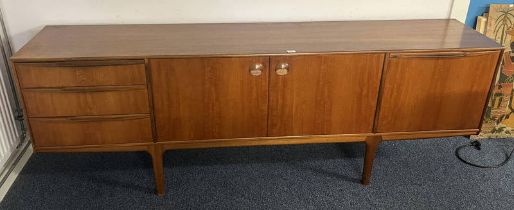 MCINTOSH TEAK SIDEBOARD WITH 3 DRAWERS & 3 PANEL DOORS ON TAPERED SUPPORTS.