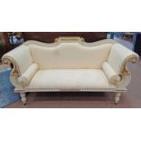WHITE & GILT SCROLL ARM SETTEE WITH SHAPED BACK ON DECORATIVE REEDED SUPPORTS