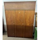 TEAK WARDROBE WITH 3 PANEL DOOR & SINGLE LIFT PANEL DOOR ABOVE ON PLINTH BASE.