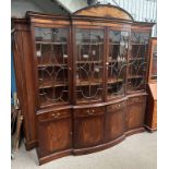 20TH CENTURY MAHOGANY SERPENTINE BREAK FRONT BOOKCASE WITH 4 ASTRAGAL GLAZED DOORS OVER 4 DRAWERS &