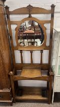 19TH CENTURY OAK MIRROR BACK HALL STAND WITH LIFT-UP LID ON SQUARE SUPPORTS.