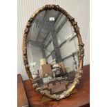 GILT FRAMED OVAL DRESSING TABLE MIRROR WITH FLORAL DECORATION - 78 CM TALL