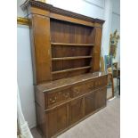 19TH CENTURY OAK DRESSER WITH SHELF BACK WITH 2 PANEL DOORS OVER BASE WITH 1 SHORT & 1 LONG DRAWER