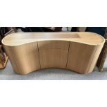 SKOVBY SHAPED TEAK SIDEBOARD WITH 5 PANEL DOORS OPENING TO SHELVED INTERIOR.