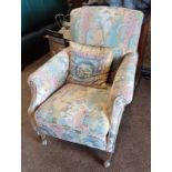 EARLY 20TH CENTURY MAHOGANY FRAMED OVERSTUFFED ARMCHAIR ON SQUARE TAPERED SUPPORTS