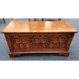 OAK COFFER WITH LIFT-UP LID & CARVED PANEL FRONT ON BRACKET SUPPORTS