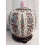 ORIENTAL LIDDED GINGER JAR WITH FLORAL DECORATION WITH 6 CHARACTER MARKS TO BASE, ON HARDWOOD STAND,