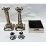 PAIR OF SILVER CANDLESTICKS ON SQUARE BOXES,