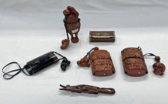 ORIENTAL CARVED HARDWOOD INROS WITH EROTIC SCENE, CARVED AS MAN IN A BASKET,