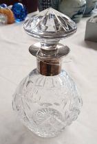 SILVER MOUNTED CUT GLASS DECANTER.