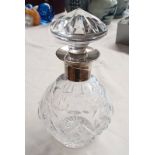 SILVER MOUNTED CUT GLASS DECANTER.