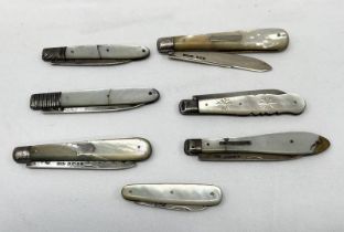 SEVEN MOTHER OF PEARL HANDLED APPLE KNIVES
