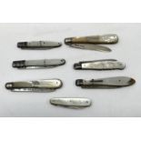 SEVEN MOTHER OF PEARL HANDLED APPLE KNIVES