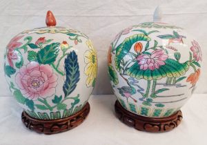 2 ORIENTAL LIDDED GINGER JARS, ONE WITH BIRD & FLYTRAP DECORATION & 6 CHARACTER MARKS TO BASE,