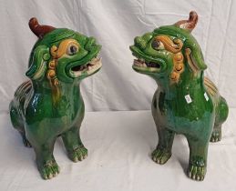 PAIR OF GREEN & YELLOW GLAZED POTTERY CHINESE DOGS OF FOO,