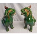 PAIR OF GREEN & YELLOW GLAZED POTTERY CHINESE DOGS OF FOO,