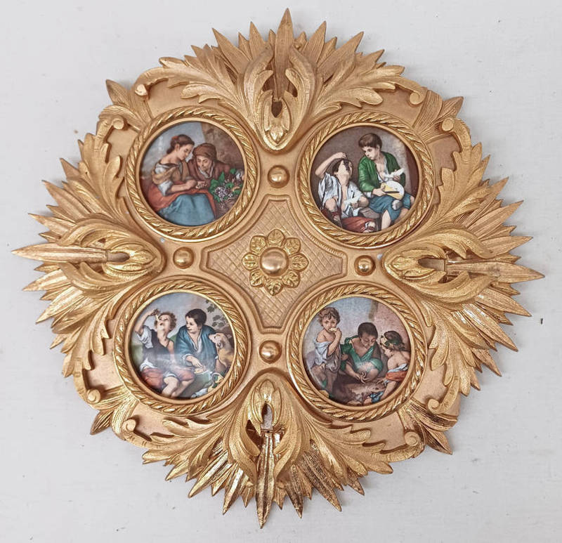 4 PORCELAIN PLAQUES DEPICTING VARIOUS FIGURES MOUNTED IN A ORMOLU FRAME Condition