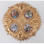 4 PORCELAIN PLAQUES DEPICTING VARIOUS FIGURES MOUNTED IN A ORMOLU FRAME Condition