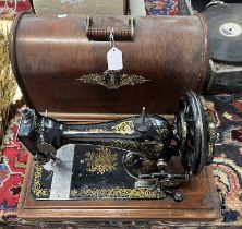 EARLY MODEL SINGER SEWING MACHINE, BLACK WITH GOLD DETAILS THROUGHOUT, SERIAL NO.