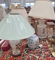 4 PORCELAIN BASED LAMPS, ALL WITH FLORAL DECORATION THROUGHOUT,