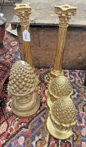 3 GILT PINEAPPLE ORNAMENTS TOGETHER WITH A PAIR OF GILT CANDLESTICKS,