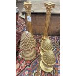 3 GILT PINEAPPLE ORNAMENTS TOGETHER WITH A PAIR OF GILT CANDLESTICKS,