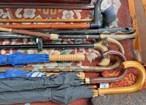 SELECTION OF WALKING STICKS, UMBRELLAS, RIDING CROPS,