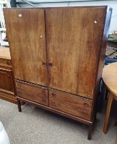 20TH CENTURY ROSEWOOD CABINET WITH 2 PANEL DOORS OVER 2 BRUSHING SLIDES OVER 4 DRAWERS ON SQUARE