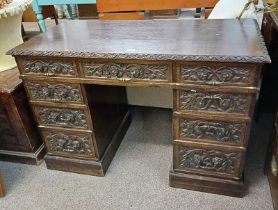 19TH CENTURY CARVED OAK KNEEHOLE DESK WITH CENTRALLY SET SINGLE LONG DRAWER FLANKED BY 2 STACKS OF